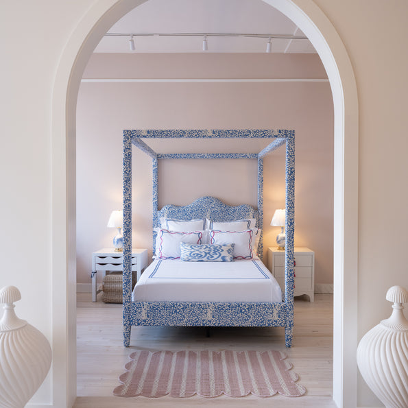 A custom bed with bold print displayed at oomph Greenwich.