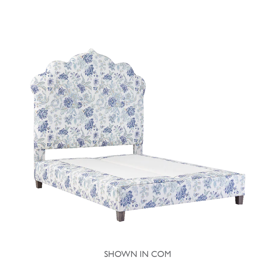 Casablanca platform bed with blue flowered pattern.