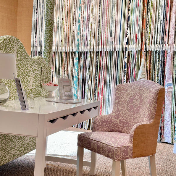 A red patterned bespoke chair on display at oomph in Dallas.