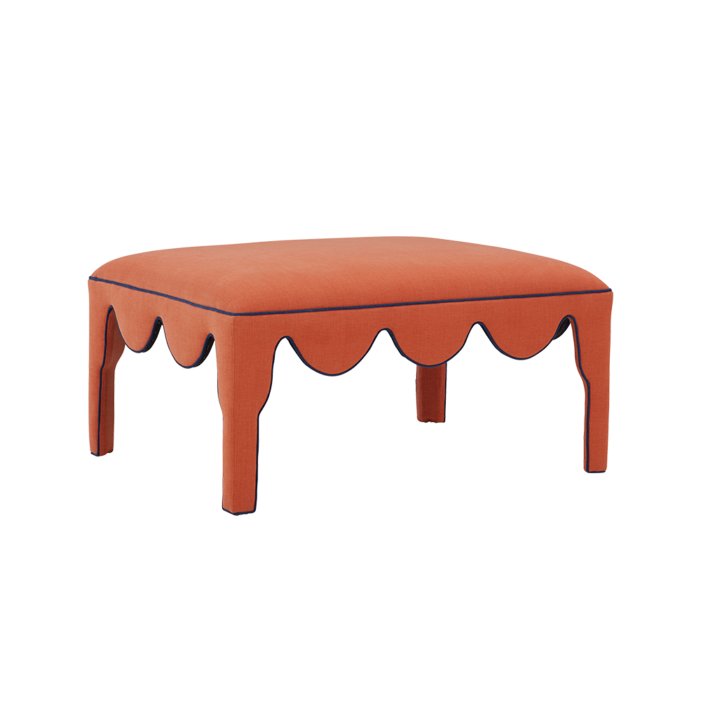 Luxury orange upholstered ottoman.